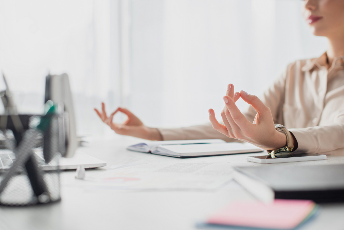 Businesswoman Meditating at Desk