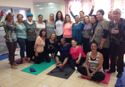 Smiling Women Posing Together in Yoga Studio